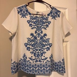 White and blue pattern top with keyhole back